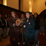 The yule logs are carried into the Great Hall.