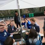 Friends take advantage of the warm January day and gather outside on the Sadler Terrace.