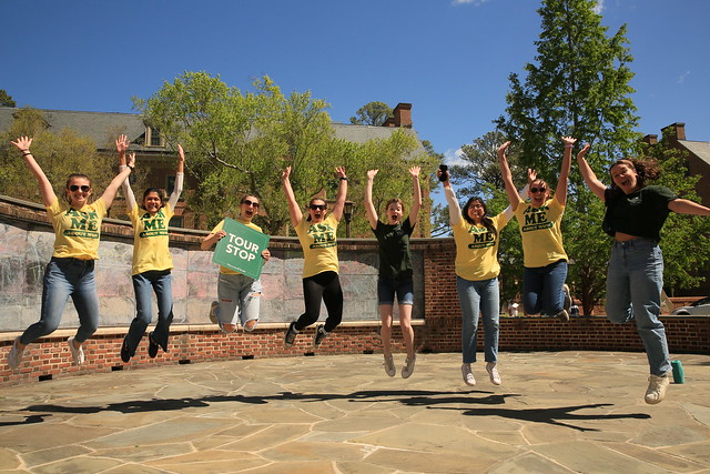 W&M students jumping for joy at the gorgeous weather during DFAS!