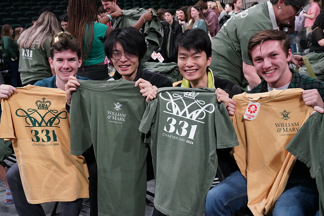 Students show off the T-shirts that were being given out for Charter Day 2024.